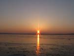 Die Sonne geht über dem Wolziger See auf